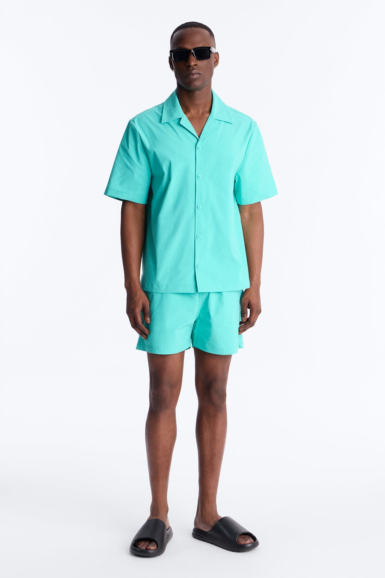 Montez Stretch Swim Trunk 4″ - Teal