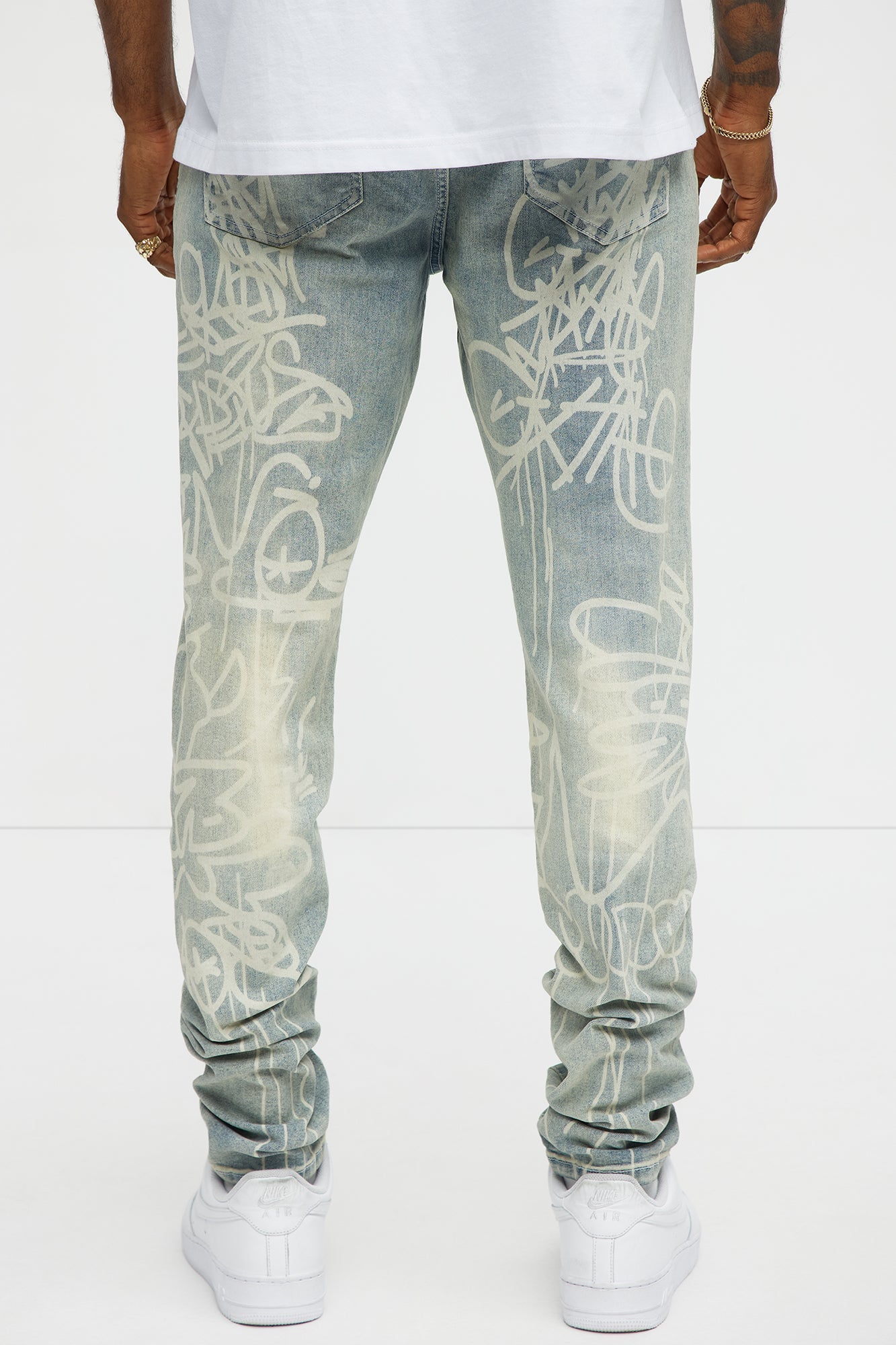 Graffiti Art Stacked Skinny Jeans - Light Wash